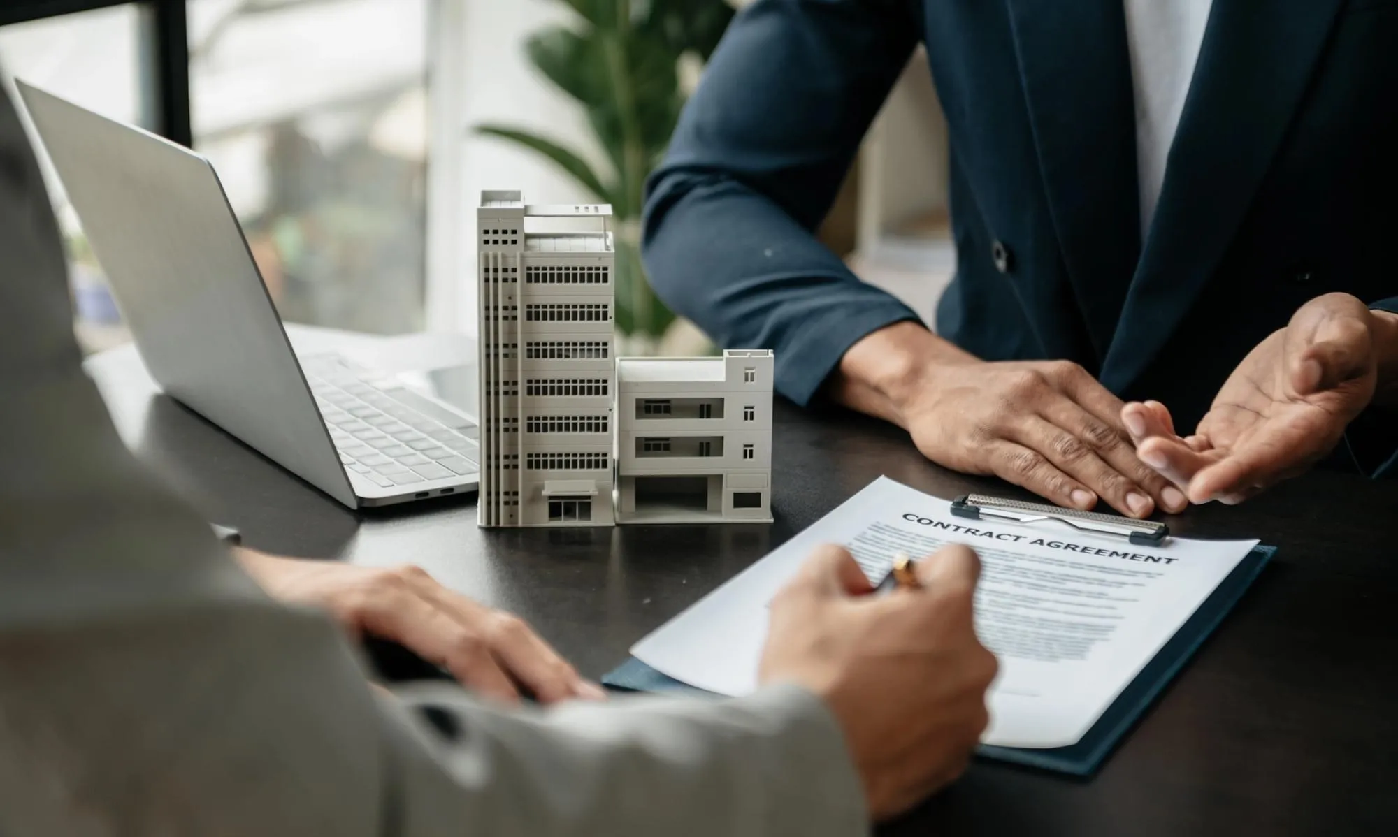 Real estate lawyer reviewing mortgage refinance documents with client in Mississauga
